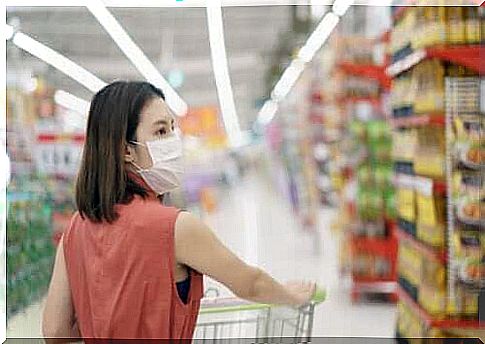 Woman shopping in supermarket with bandage on