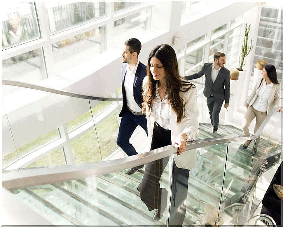 Office workers taking the stairs