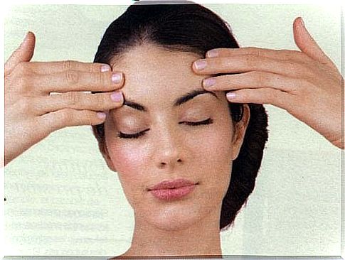 woman massaging her forehead