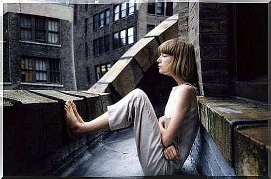 Woman sitting outside with bare feet