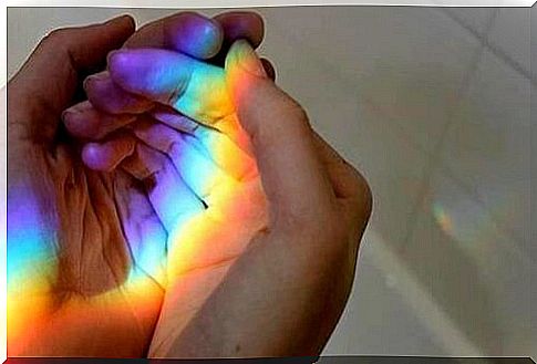 Person with rainbow on his hands