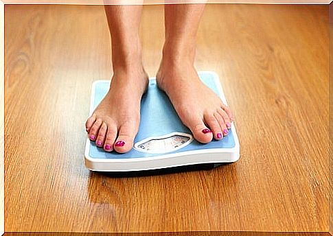 Woman on a bathroom scale - several nuts