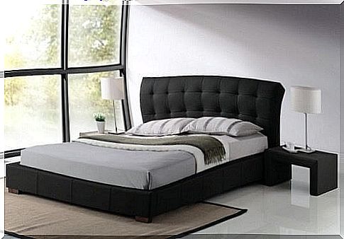 Make bed in a bedroom