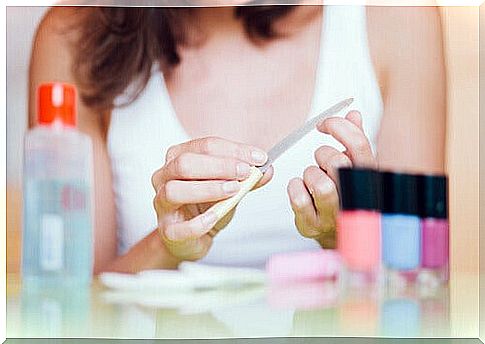 Woman filing nails