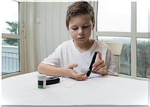 Boy checks his blood sugar level