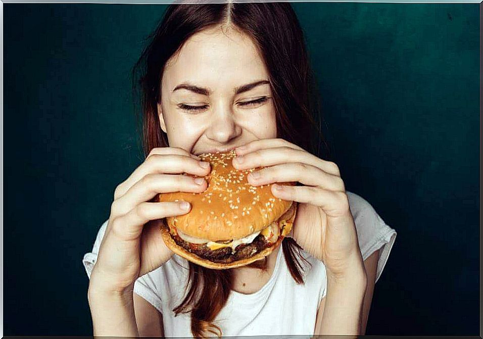 Woman eating burger