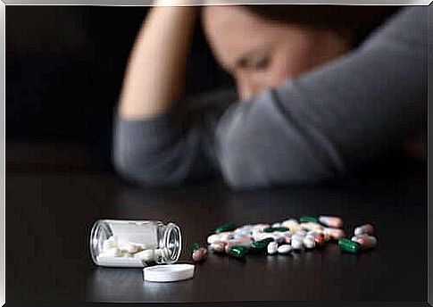 Woman with pills that can lead to drowsiness