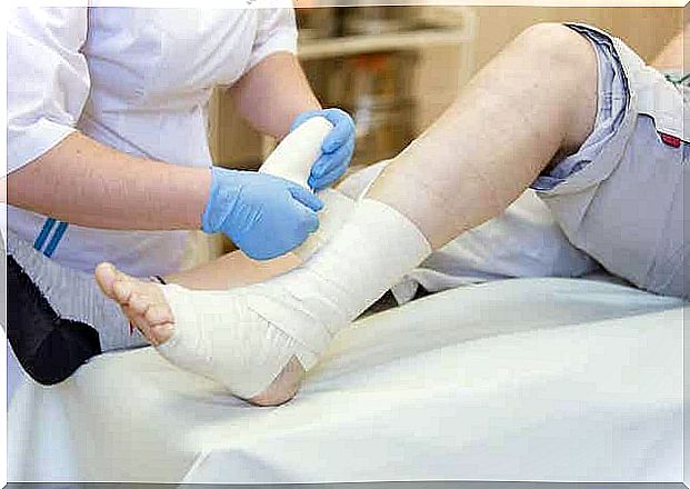 A doctor puts plaster on patient