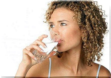 A woman drinks water