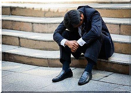 Man on stairs experiences that stress can aggravate gastritis