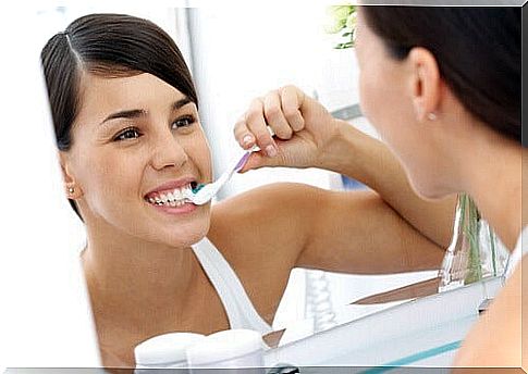 Woman brushing teeth