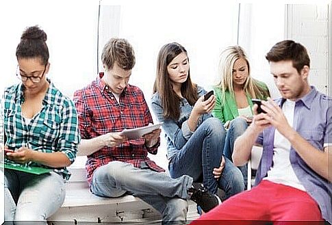 Group of young people who are addicted to gadgets