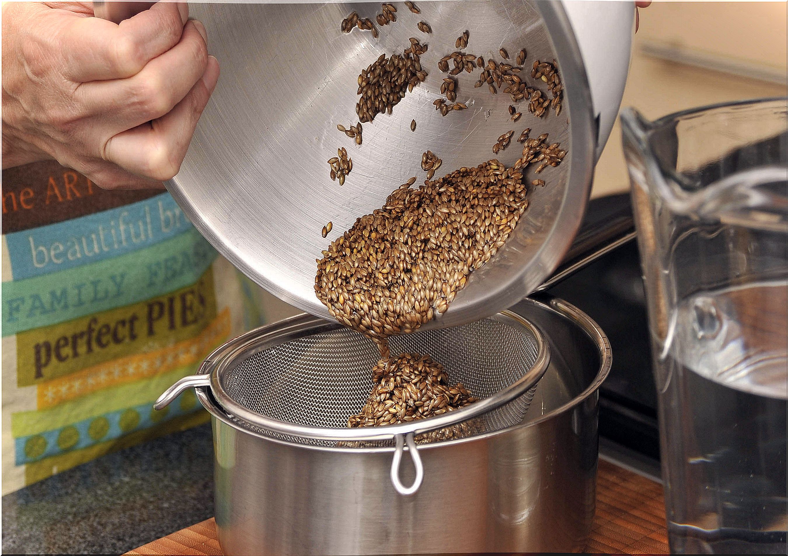 Seeds are poured into a sieve.