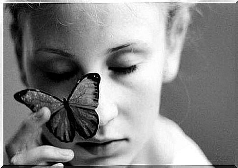 Woman holding a butterfly