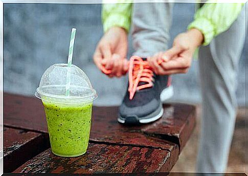 Person ties laces in front of protein drink