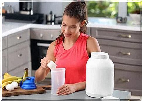 Woman mixes protein drinks