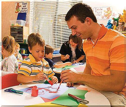 Man painting with his sow at school