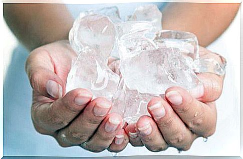 Person holding ice cubes