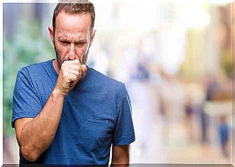 A man with bronchitis coughs