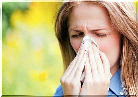 Woman brushes nose