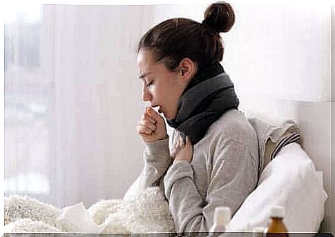 Woman in sofa coughing